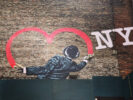 NYC wall art - man drawing heart