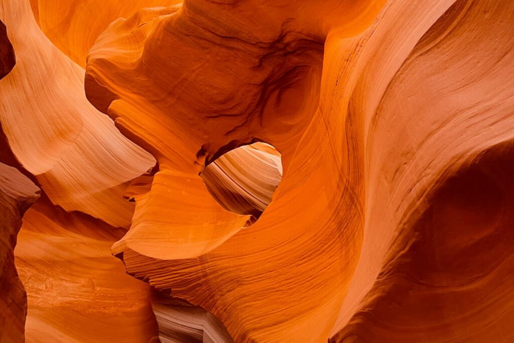 warm orange wavy walls of Lower Antelope Canyon